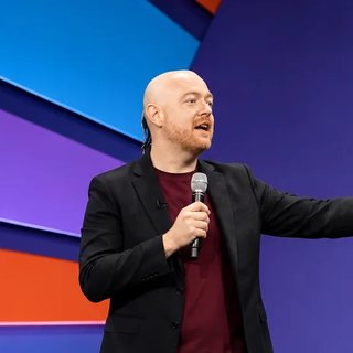 Dan Fitzpatrick speaking on stage